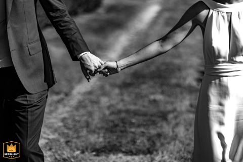 At Chateau de la Mercerie, Charente, two hands unite in a fleeting romantic moment, the world fading as their connection quietly anchors them amid timeless stone and centuries-old gardens.