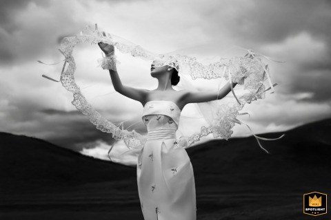 At an outdoor venue in Shantou, Guangdong, China, the bride is photographed in a black-and-white portrait, emphasizing her elegance, expression, and the timeless character of the image.