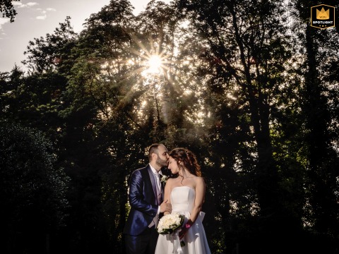 Bride And Groom Embrace Within Historic Piovera Castle In Italy The bride and groom stand together at Piovera Castle, Italy, sharing a quiet and intimate wedding-day embrace within the historic surroundings of the estate.