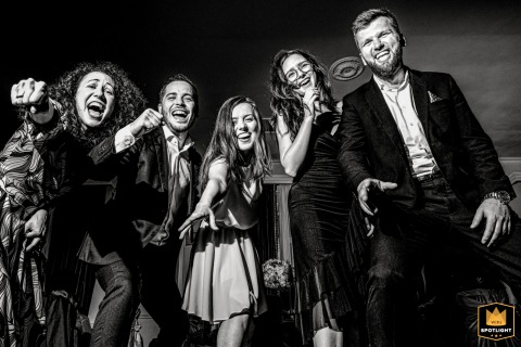 Laughter, movement, and genuine emotion fill the dance floor in Bucharest, Romania, creating a vibrant scene of connection, energy, and wedding celebration.