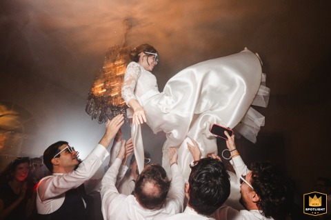 The bride enjoys the celebration during the wedding party at Vigna Chinet, surrounded by the energy and excitement of the reception.