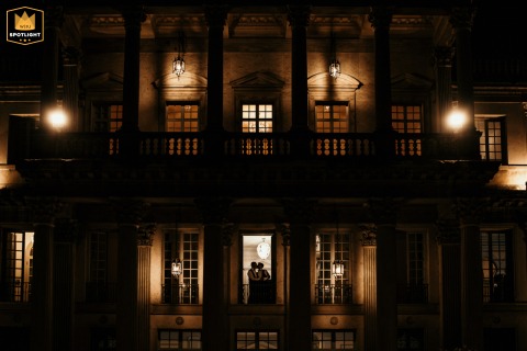 At Villa des Vergers in Rimini, the groom's silhouette kisses his partner inside the villa, closing the day with a softly lit and elegant final image.