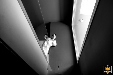 At a private villa in Cesena, the bride appears in black and white just after getting dressed, her calm expression emphasizing the intimacy of the preparation.