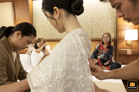 At Asia Hotel Bangkok, the bride gets ready with calm focus, surrounded by preparations that set the tone for the celebration ahead today with family.