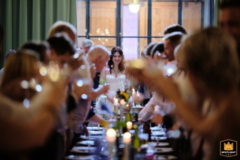 Guests raise a toast to the bride at The Mowbray in Sheffield, UK, filling the reception with warmth and celebration throughout the room all night.