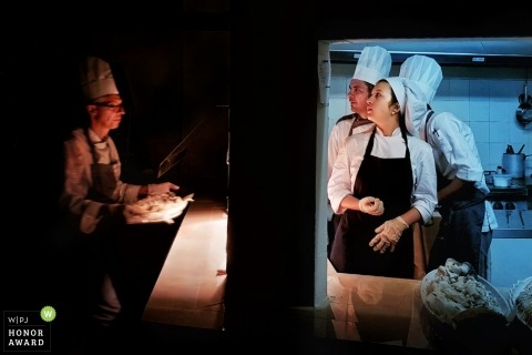 Chefs prepare the food for the Tuscany wedding reception
