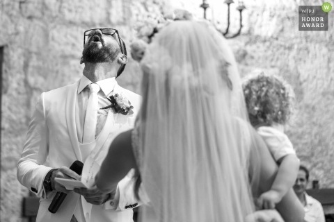 Orvieto wedding shoot with a groom looking to the sky as he attempts to recite his vows in the church