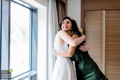 wedding photograph of bride hugging Documentary wedding photograph of bride hugging at Istanbul, Turkey