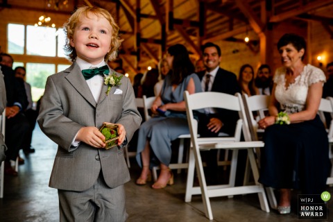 Virginia Wedding Photo of The ring bearer walking proudly down the aisle Stoneyman Ranch, Luray, Virginia Wedding Photography | The ring bearer walks proudly down the aisle
