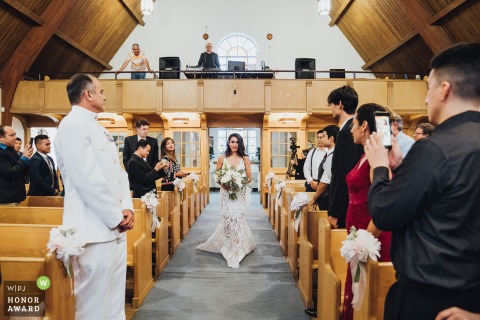 Virginia indoor ceremony wedding photo of the Bride walking in the church