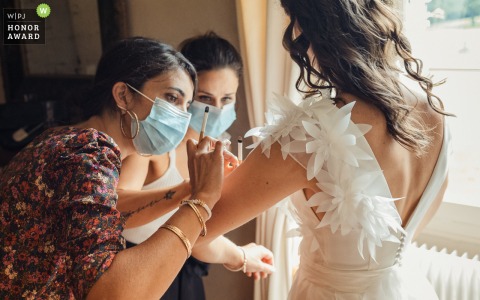 The France WPJA is the alternative to traditional wedding images and is pleased to present this inspiring wedding photography example from Chateau de Malliac in Gers showing make-up artists around the French bride  