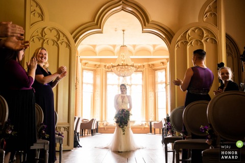 The bride enters the room for the ceremony....her entrance is like a fairytale at the Kasteel de Schaffelaar in Barneveld