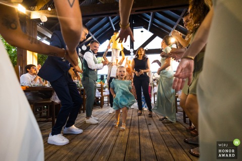 A professional wedding photographer created this award-winning WPJA photo at Domaine des Medards. The image captures a little girl dancing at the wedding.