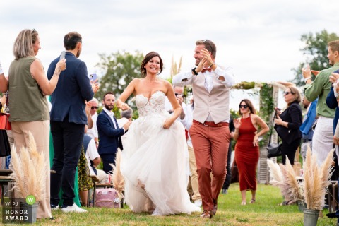 At Lot-et-Garonne, as the secular ceremony concludes, there is a joyful atmosphere filled with smiles and applause from the guests.