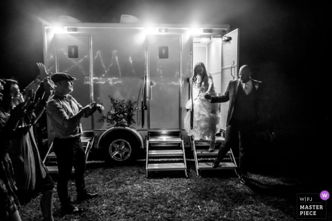 Guests at The Retreat in Sarasota burst into laughter as they spot the bride and groom exiting the restroom together.