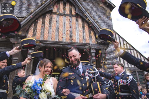 At Eglise Sainte Catherine, Honfleur, the newlyweds exit the church at the end of the ceremony, radiating joy and excitement.