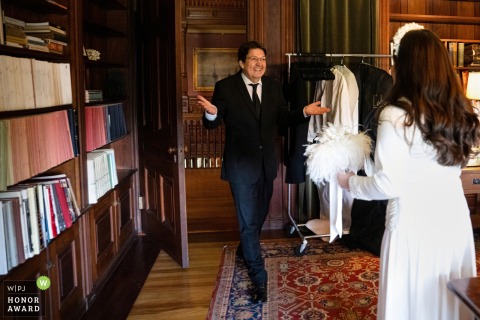 Father of the bride throws hands in the air seeing daughter in wedding dress at Eustis Estate, Milton, MA, first.