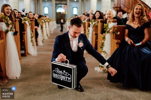 Reluctant Ring Bearer Humorously Replaced by Father at Fribourg Church Ceremony At a Fribourg, Switzerland church ceremony, the reluctant ring bearer is humorously replaced by his father, who playfully imitates him.