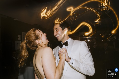 Bride and groom dance joyfully together at Soho House Istanbul, lost in the moment as if nobody is watching them.