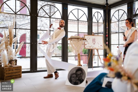   At Domaine de Grand Maison en Isère, the officiant delivers an intentionally long-winded speech, filling the ceremony with laughter and delight among the guests.