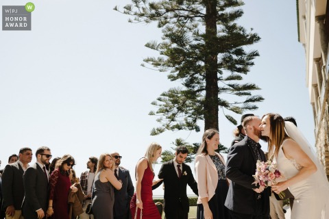 Bride Warmly Greets Family and Guests Exchanging Smiles After Ceremony at Hotel Vila Galé Ericeira Lisbon The bride warmly greets guests and family following the ceremony, exchanging smiles and embraces at Hotel Vila Galé Ericeira.