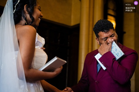 At The Grand Baltimore, the groom wipes away tears as the bride speaks emotionally about their shared love for family.