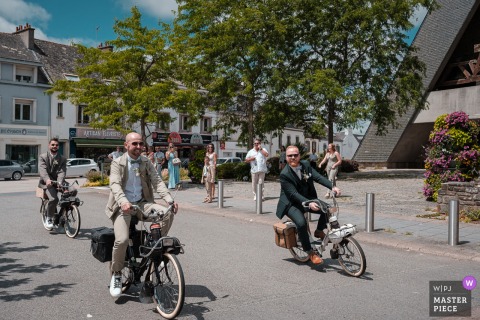 At Caudan Town Hall in Brittany, a vintage French "Solex" moped becomes a unique part of the celebration. The award-winning photograph highlights the photographer’s skill at documenting personal and nostalgic wedding details.