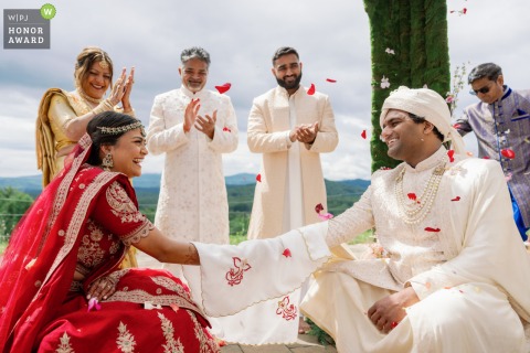 At Hazy Mountain Vineyards in Charlottesville, Virginia, the couple shares a breathtaking first look as the delicate veil separating them is finally lifted just before their wedding ceremony begins.