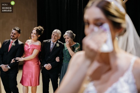 A São Paulo bride, Brazil, is visibly moved to tears, capturing a raw and artistic expression of emotion during the poignant moments of the marriage ceremony.
