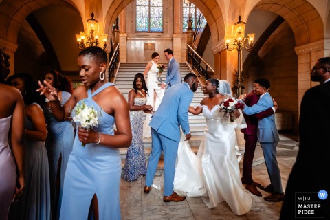 Newlyweds Descend Stairs After Ceremony In 's-Hertogenbosch Noord Brabant Highlighting Post-Ceremony Excitement At a ceremony in 's-Hertogenbosch, Noord Brabant, the photographer captures the newlyweds after descending the stairs after the ceremony, expertly highlighting post-ceremony excitement.