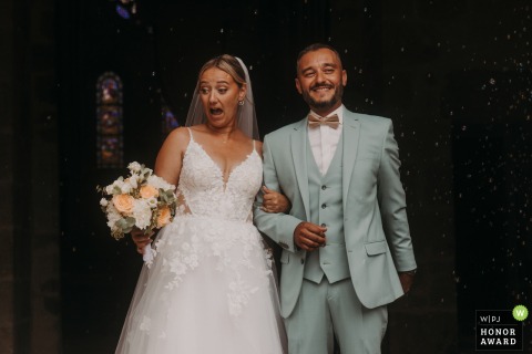 Inside a traditional church in Cher, a woman lets out a joyful and spirited cry, adding an expressive and artistic touch to the atmosphere of the wedding ceremony proceedings.
