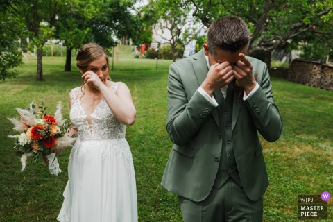 Tears of joy shared by Moselle bride and groom in a garden.