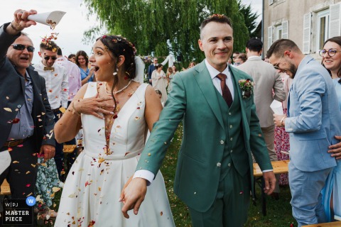 Celebration with confetti as the bride and groom leave the Metz wedding ceremony.