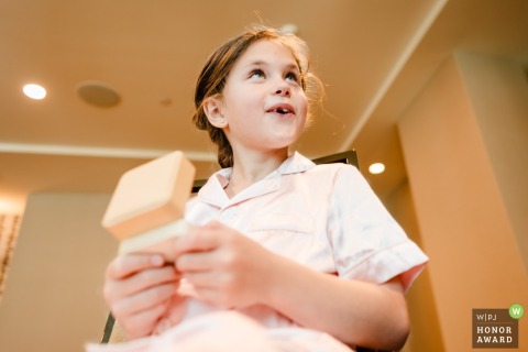 A delicate flower girl gift sits displayed in Atlanta, Georgia, serving as a charming detail that highlights the thoughtful preparations and small, artistic touches of a traditional wedding day.