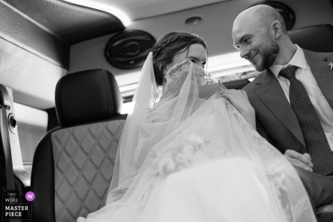 Bride Playfully Peeks From Veil Capturing Authentic, Timely, and Intimate Wedding Storytelling A WPJA-winning black-and-white image captures a playful, intimate moment as a bride peeks from behind her veil, highlighting the photographer’s exceptional timing and sensitivity to authentic wedding storytelling.