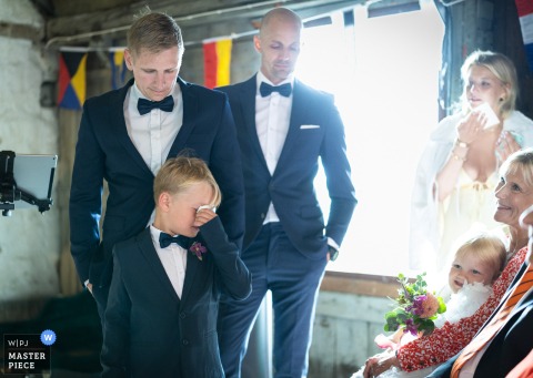 At Smedjans Hus in Barsebäckshamn, Sweden, the son of the bride and groom becomes emotional during the ceremony.