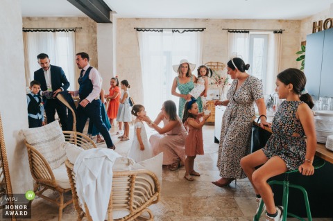 Inside Domaine de la Rose Blanche in Tresses, Gironde, everyone busily prepares for the upcoming ceremony, with excitement and anticipation filling the air.