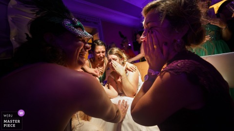 At a reception venue in Dordogne, Nouvelle-Aquitaine, the bride breaks down in tears after watching a surprise slideshow, overwhelmed by emotion and love from her family and friends.