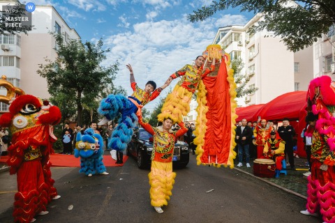 In Binzhou, Shandong, a colorful lion dance unfolds in the urban streets as part of the traditional wedding send-off before the couple departs.