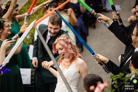 Chateau Ramezay in Montreal, Quebec, becomes the scene as the newlyweds dash beneath an archway of friends’ raised lightsabers and fantasy swords after their Star Wars ceremony.