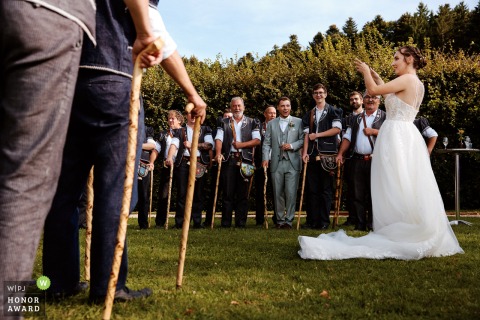 In Fribourg, Switzerland, the bride leads the singers of the Choeur des Armaillis de la Gruyères, all dressed in traditional costume, for a memorable performance. 