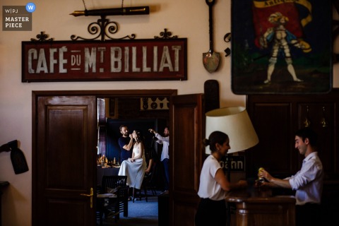 At the Koc Museum in Istanbul, Turkiye, the bride prepares for her big day in one room while the rest of the wedding party enjoy themselves in another, capturing anticipation and the separate rhythms of wedding preparations.