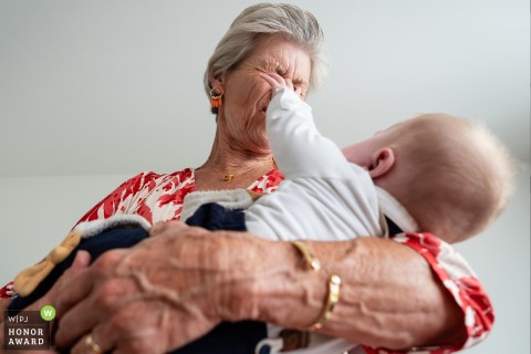 At Alphen aan den Rijn in the Netherlands, a humorous and unexpected moment unfolds when the grandmother ends up getting playfully poked in the eyes during the festivities.