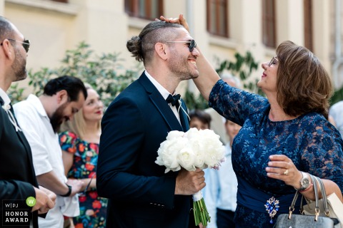 A Mother And Son Enjoy A Heartwarming And Tender Moment While Waiting For The Bride In Istanbul Turkey In Istanbul, Turkey, a heartwarming pause takes place as a mother and her son enjoy a tender moment together while waiting for the bride’s arrival.