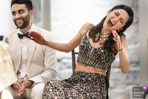 Joy Radiates As The Bride Listens To Her Sister’s Speech During The Reception At Greystone At Piedmont Park, Atlanta. At Greystone at Piedmont Park, Atlanta, the bride listens, reacting emotionally with joy to a memorable speech delivered by her sister during the reception.