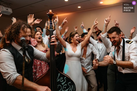   Musicians keep the energy high at Domaine de Gavaudun in Lot-et-Garonne, France, as guests hit the dance floor and celebrate during a lively party.