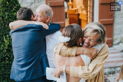   Emotional embraces are exchanged at Domaine de Pleneselve in Bon-Encontre as parents hug their children at the end of heartfelt wedding speeches, reinforcing family bonds.