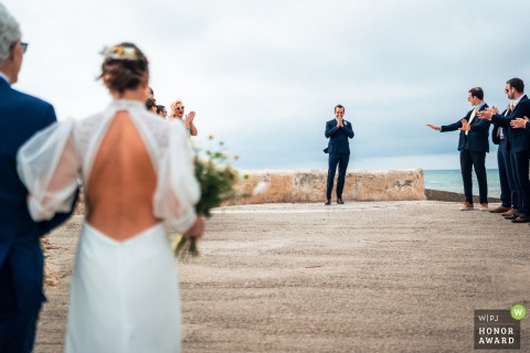 First Look Amid Picturesque Island Surroundings Offers Special Moment Of Découverte In Ars-En-Ré, Ile De Ré A special moment of découverte unfolds in Ars-en-Ré, Ile de Ré, France, as the newlyweds experience their first look amid the picturesque island surroundings.
