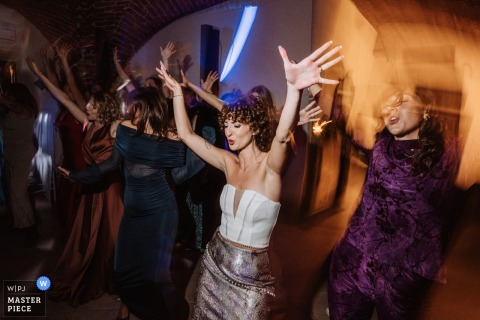 Turin’s Venue Fills With Joy And Laughter As Friends And Family Celebrate The Newlyweds At A Lively Piedmont Party. Joy and laughter fill the room during the wedding party in Turin, as friends and family celebrate and party with the newlyweds in the heart of Piedmont.