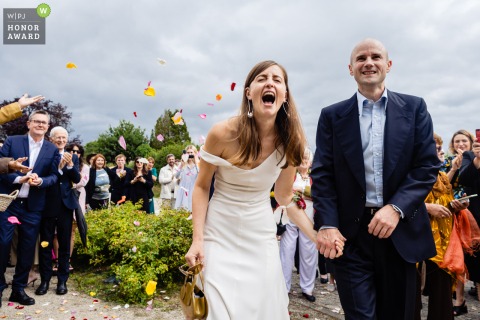 During their civil ceremony at Mairie in Normandie, the couple erupts with joy, their excitement lighting up the outdoor venue in front of delighted friends and family.